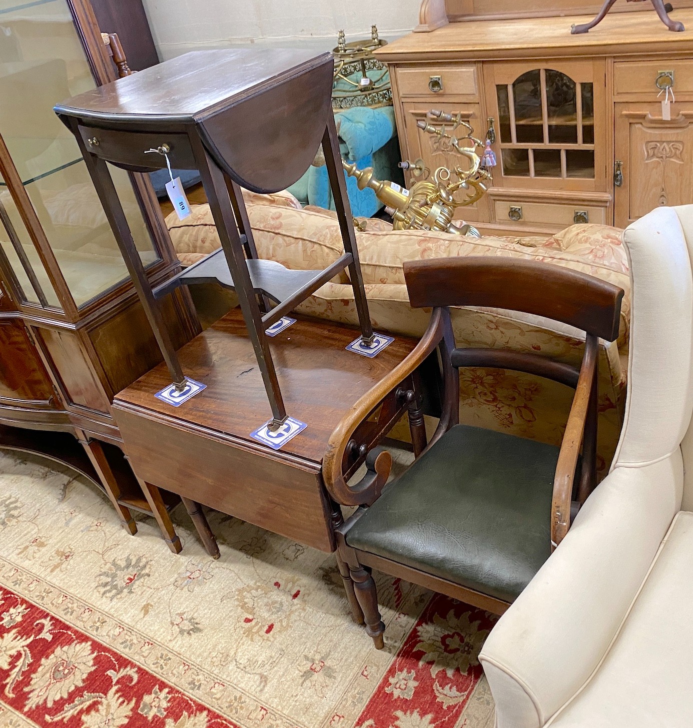 An early Victorian provincial mahogany elbow chair, and Edwardian drop flap table and a Provincial Pembroke table (cut down)